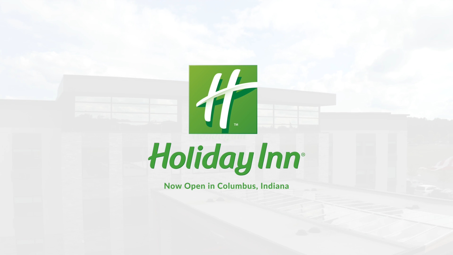 Holiday Inn logo overlayed on frosted photo of Holiday Inn, Columbus, Indiana